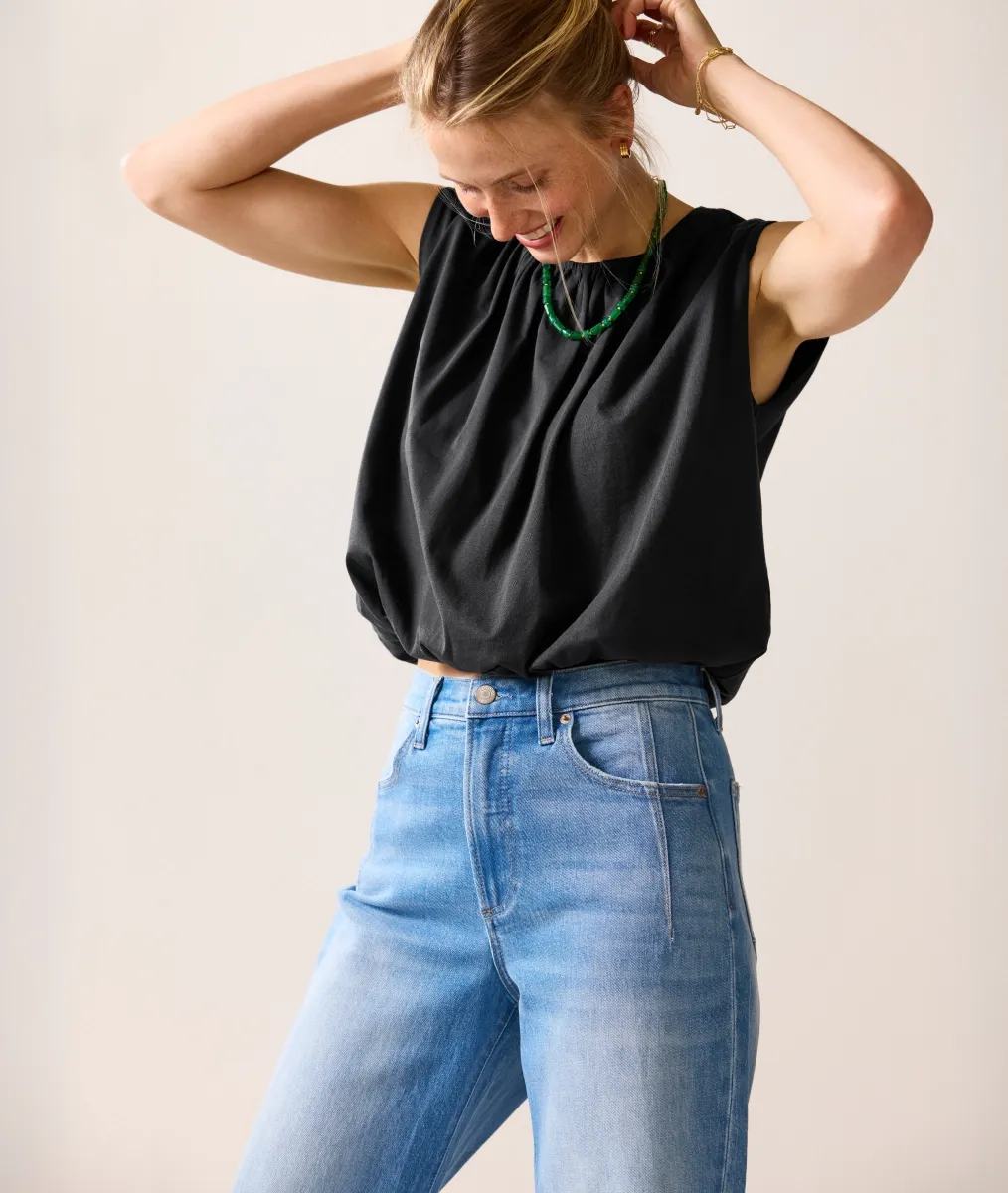 Woman Wearing Brown Shirt and Blue Jeans